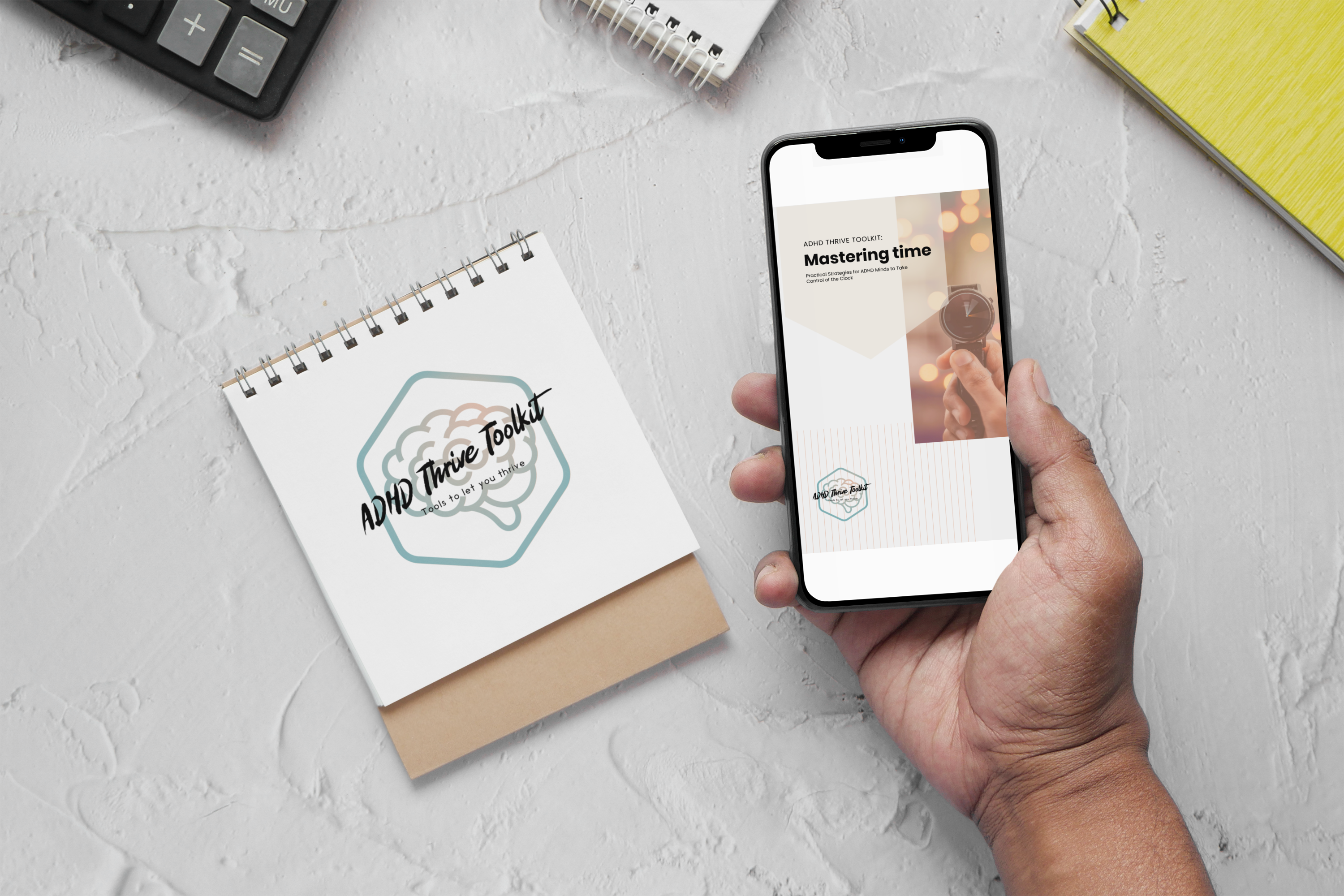 A flat lay image of an ADHD Thrive Toolkit ebook, titled 'Mastering Time,' being viewed on a mobile phone next to a notepad and a calculator. The ebook offers practical strategies for adhd time management, helping individuals with adhd take control of their schedules. The photo highlights the importance of organization and time management in adhd management, with a focus on making the most out of the available time to boost productivity and reduce stress.
