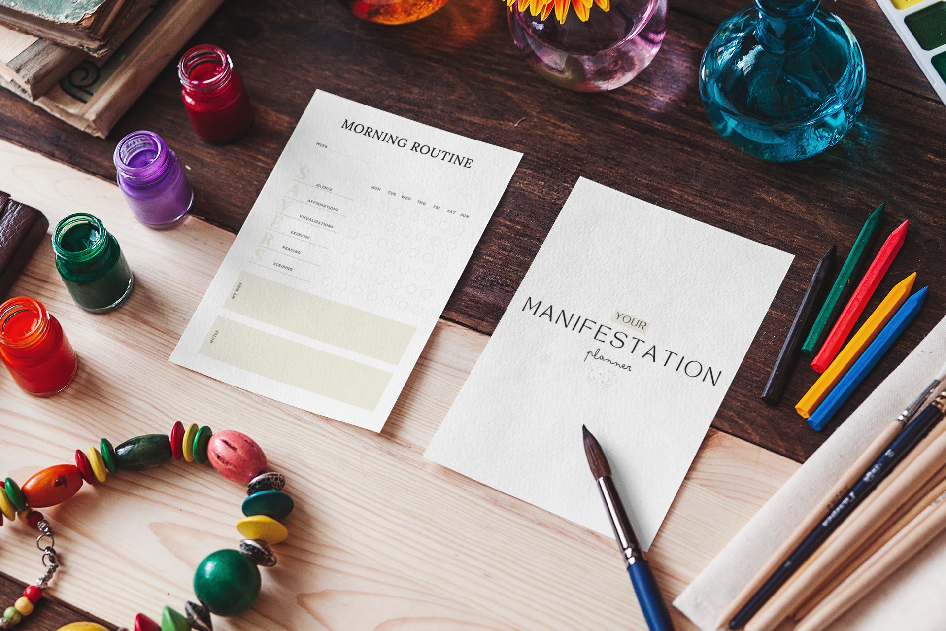 Manifestation planner and morning routine checklist on a wooden desk surrounded by colorful art supplies, designed for adhd-friendly focus and positivity. adhd management.